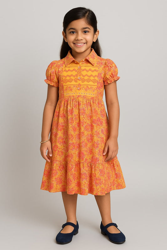 Orange floral printed girls short sleeve dress with ruffle detailing and gathered waist