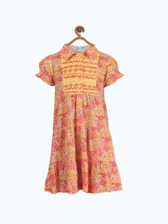 Orange floral printed girls short sleeve dress with ruffle detailing and gathered waist