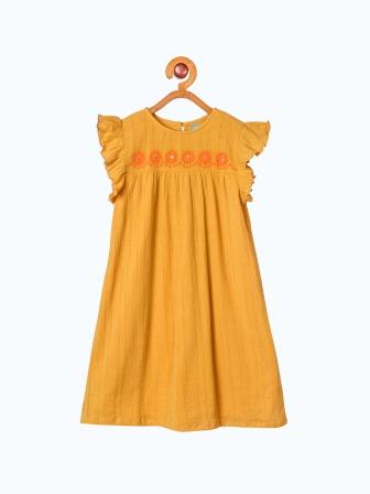 Mustard yellow girls ruffle sleeve top with gathered detailing and flared silhouette