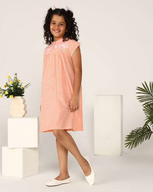 Peach girls sleeveless jumpsuit with wide-leg pants and minimal detailing