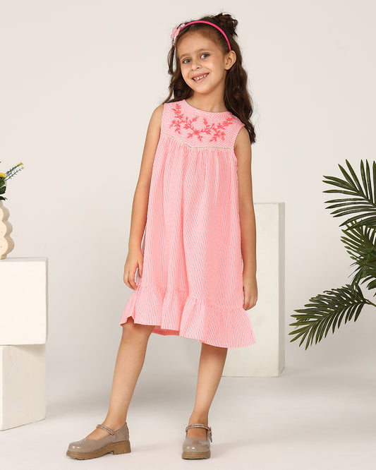 Pink girls sleeveless A-line dress with ruffle detailing and flared hem