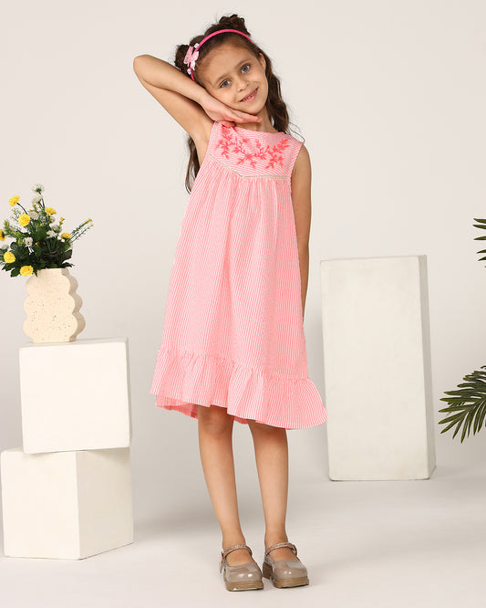 Pink girls sleeveless A-line dress with ruffle detailing and flared hem