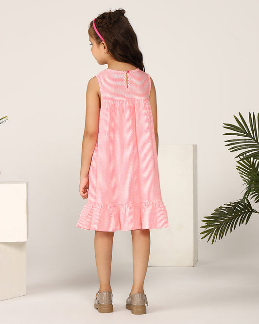 Pink girls sleeveless A-line dress with ruffle detailing and flared hem