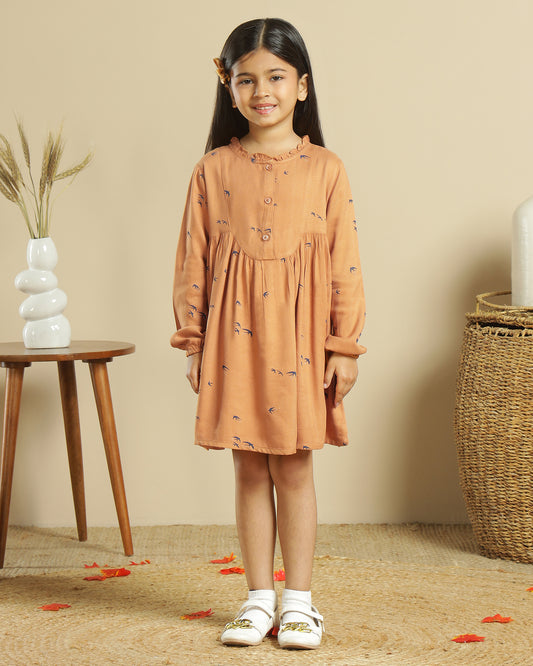 Mustard girls long sleeve dress with gathered waist, ruffle detailing and flared hem