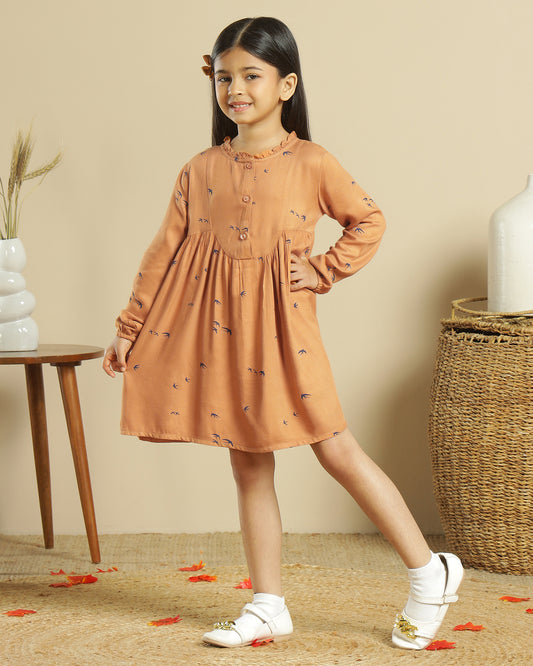 Mustard girls long sleeve dress with gathered waist, ruffle detailing and flared hem