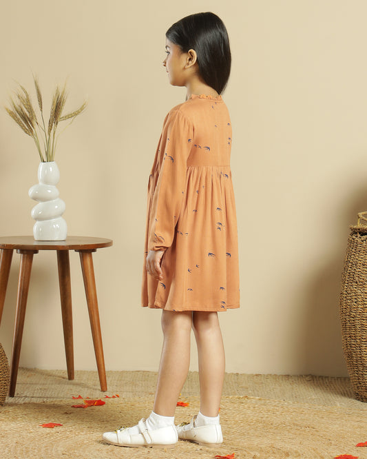 Mustard girls long sleeve dress with gathered waist, ruffle detailing and flared hem