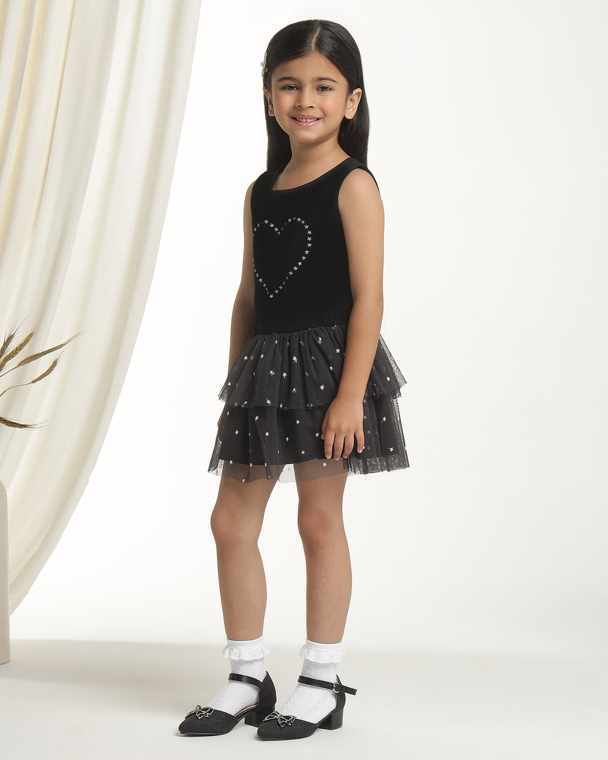 Black girls sleeveless party dress with sequin heart bodice and layered ruffle skirt