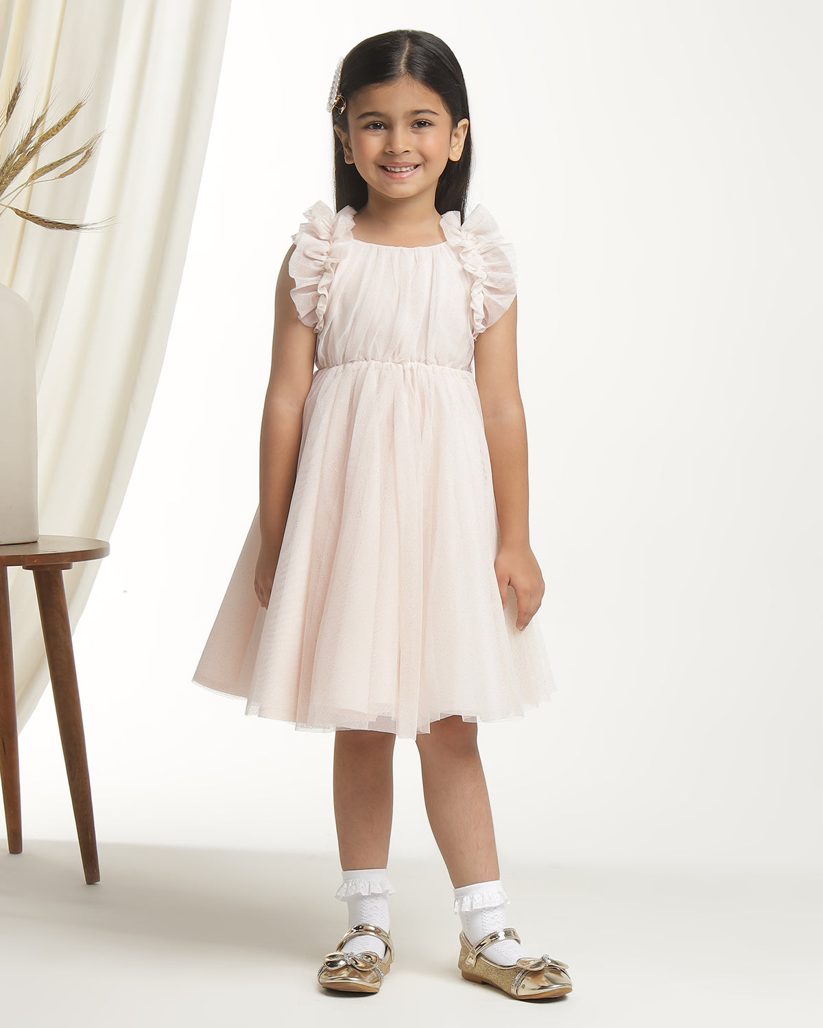Blush pink girls sleeveless fit and flare dress with pleated skirt and flared hem