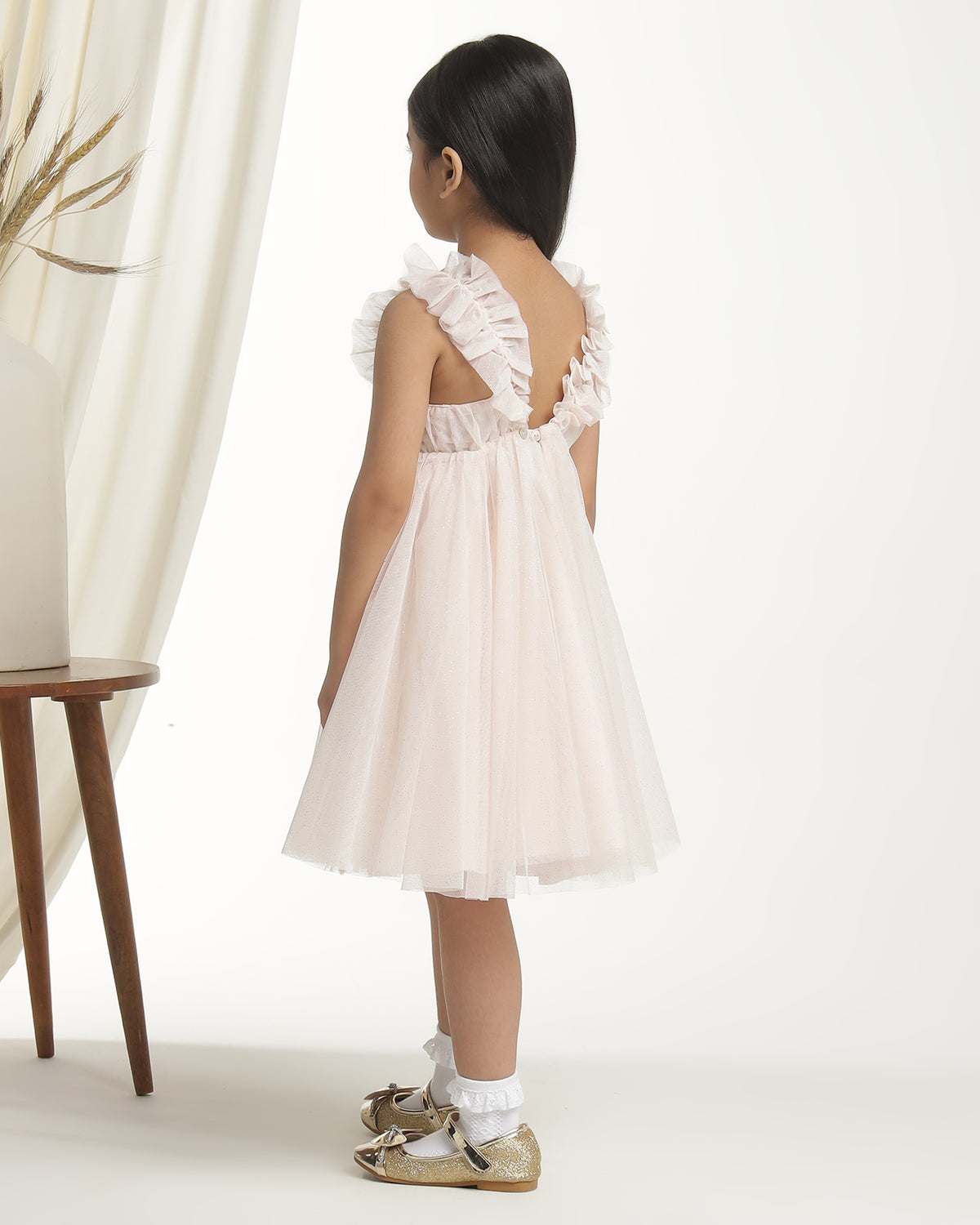 Blush pink girls sleeveless fit and flare dress with pleated skirt and flared hem