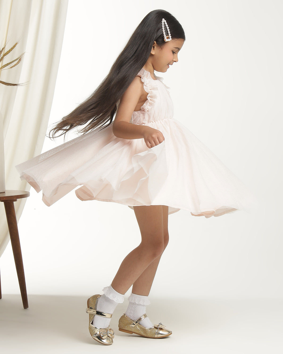 Blush pink girls sleeveless fit and flare dress with pleated skirt and flared hem