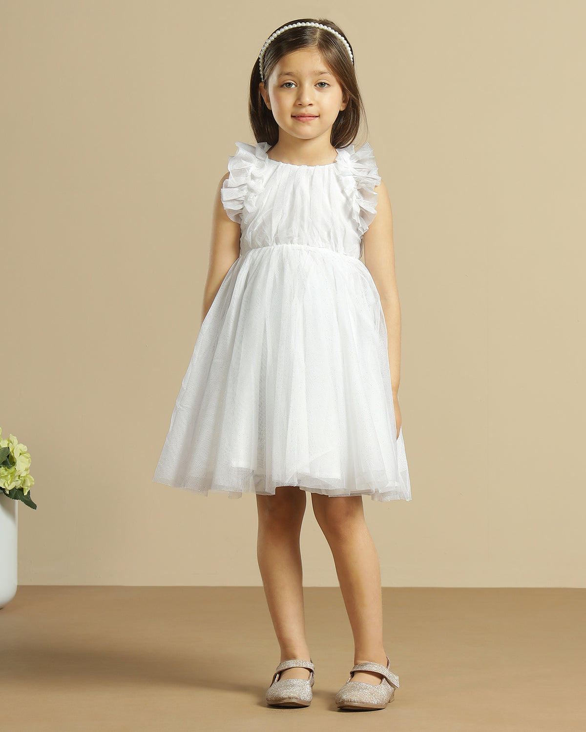 White girls sleeveless A-line dress with minimal detailing and flared hem