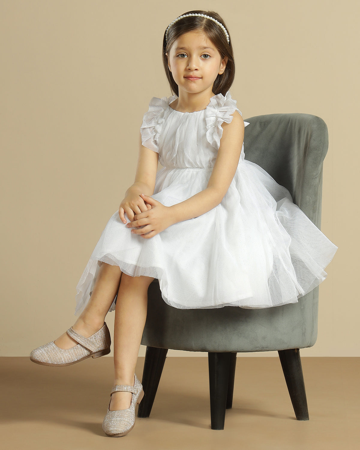White girls sleeveless A-line dress with minimal detailing and flared hem