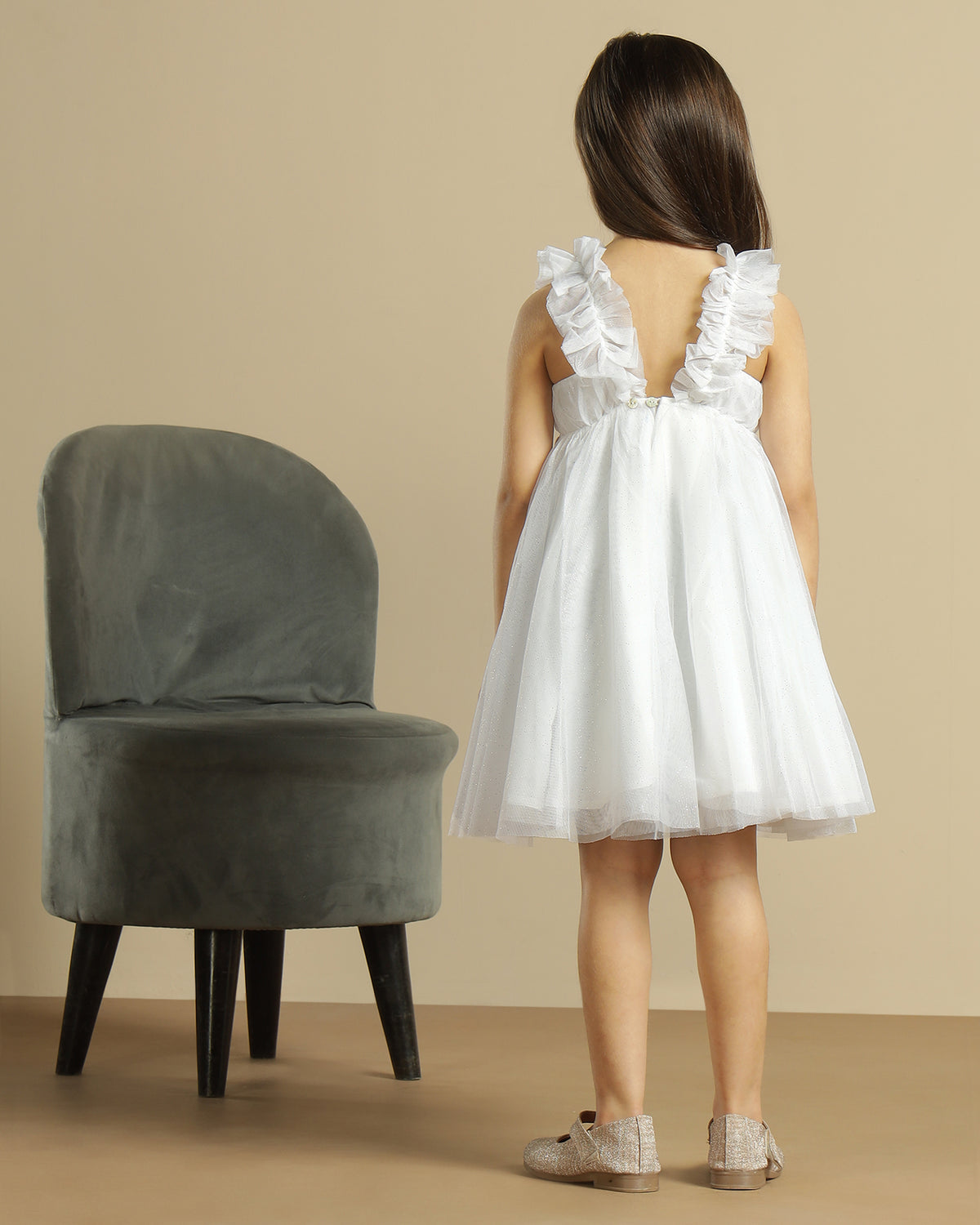 White girls sleeveless A-line dress with minimal detailing and flared hem