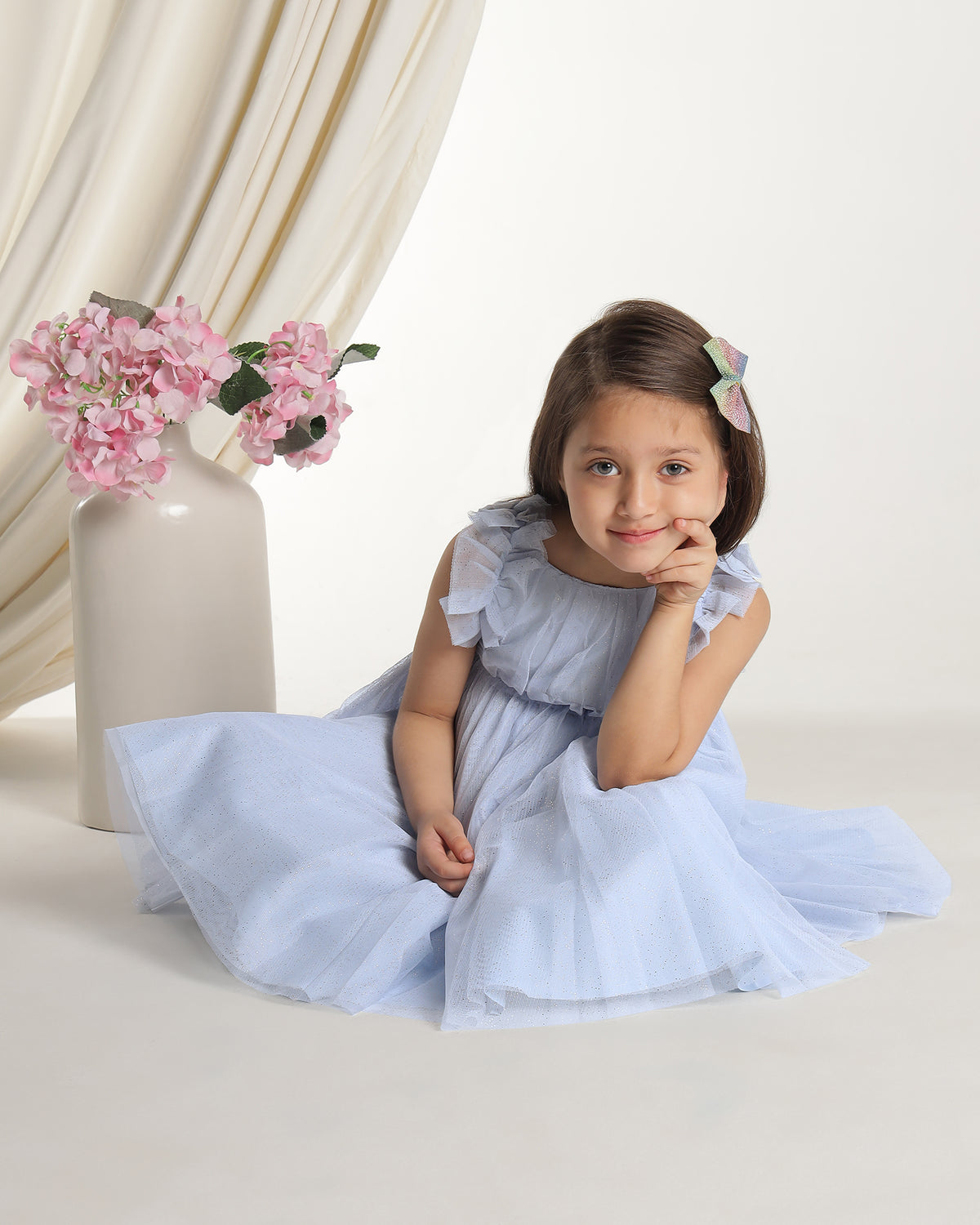 Light blue girls sleeveless fit and flare dress with pleated skirt and flared hem