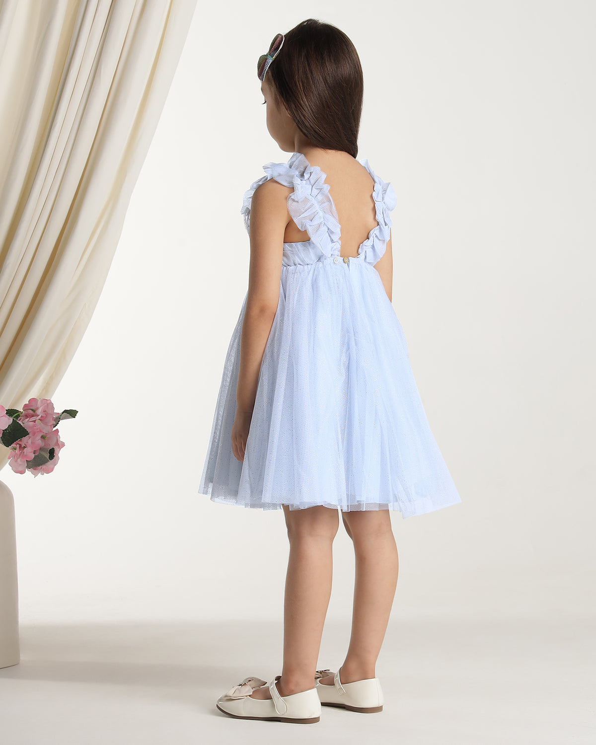 Light blue girls sleeveless fit and flare dress with pleated skirt and flared hem