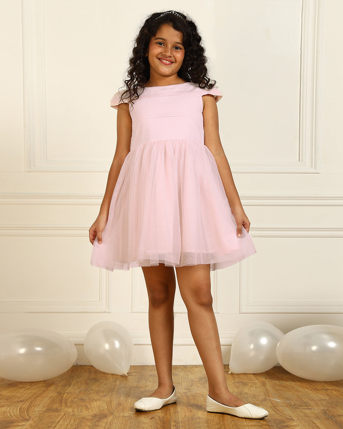 Pink girls sleeveless fit and flare dress with pleated skirt and flared hem