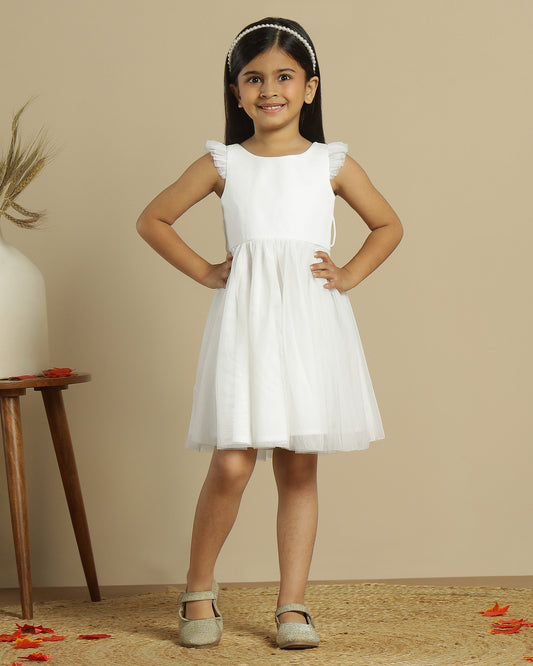 Blush pink girls layered tulle skirt with elasticated waist and flared hem