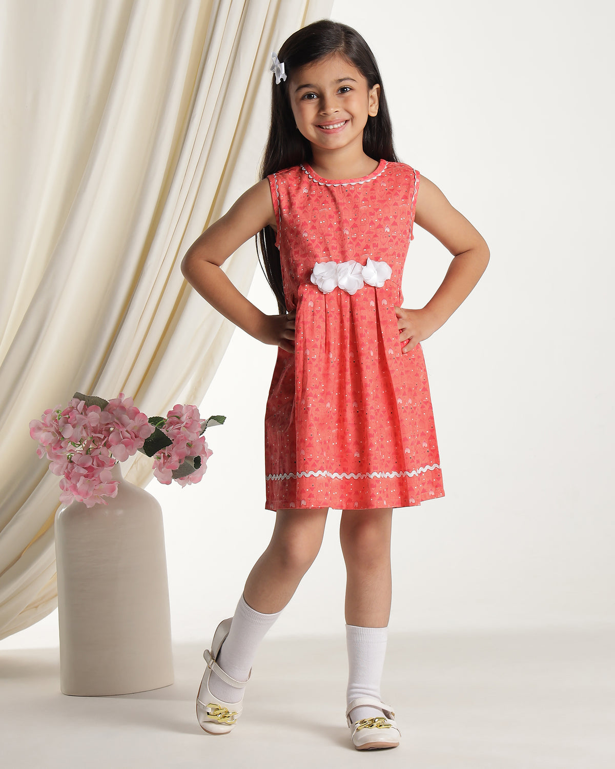 Coral girls sleeveless fit and flare dress with floral embroidery and flared hem