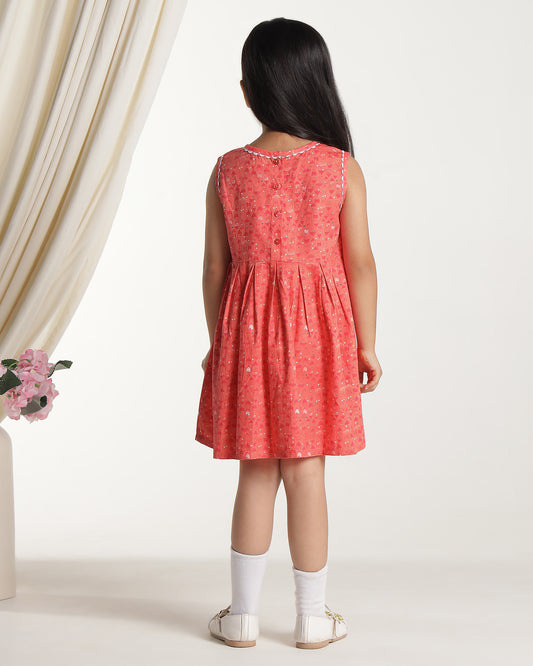 Coral girls sleeveless fit and flare dress with floral embroidery and flared hem