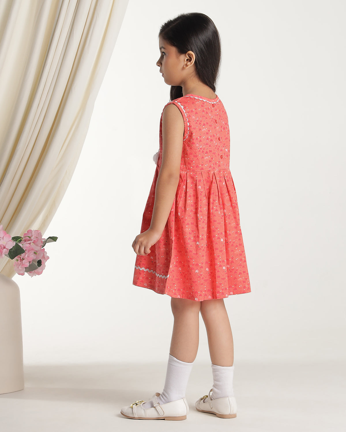 Coral girls sleeveless fit and flare dress with floral embroidery and flared hem