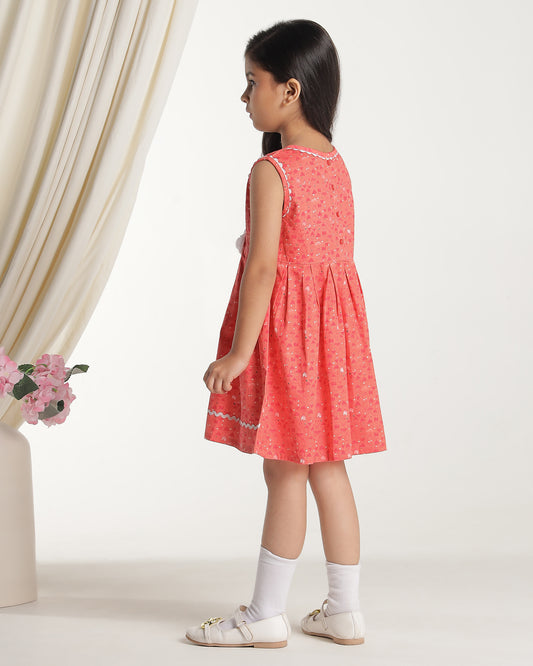 Coral girls sleeveless fit and flare dress with floral embroidery and flared hem