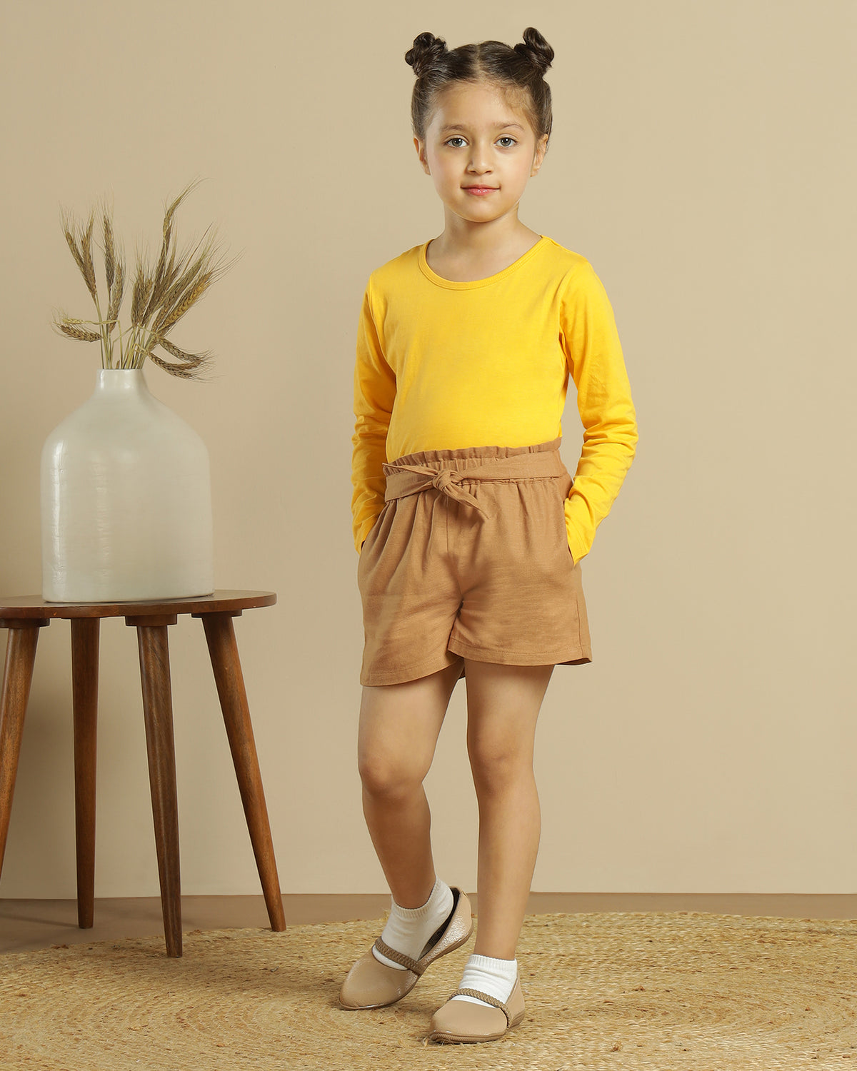 Brown girls casual shorts with elasticated waist and rolled hem
