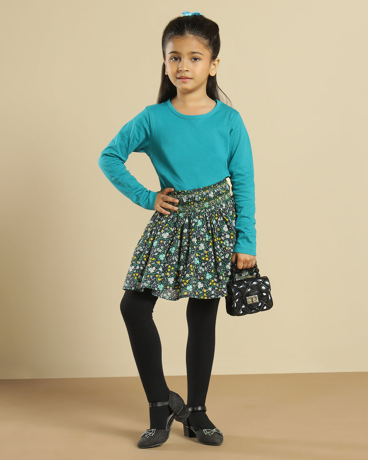 Black girls short sleeve top with green floral printed flared skirt