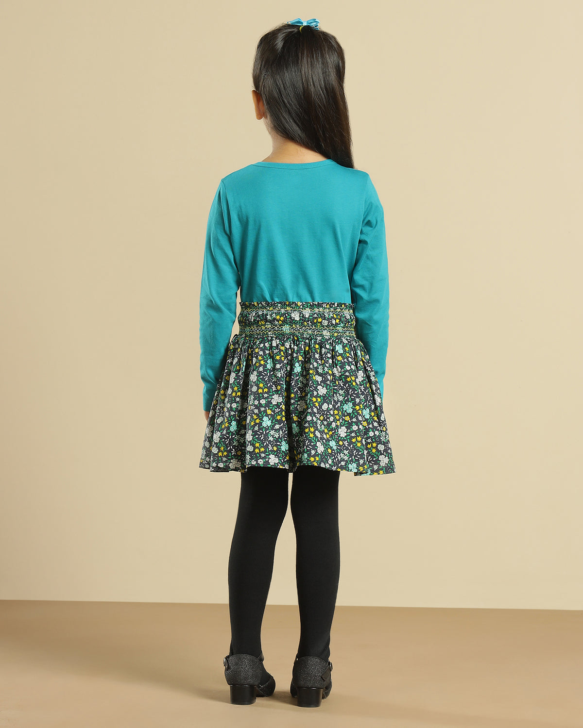 Black girls short sleeve top with green floral printed flared skirt