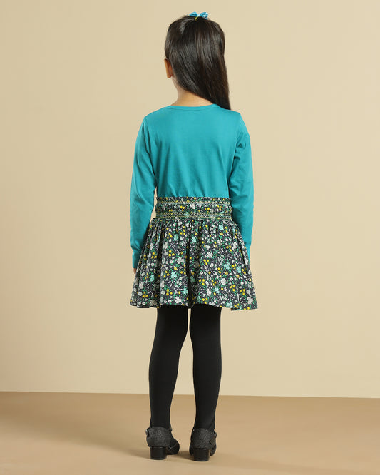 Black girls short sleeve top with green floral printed flared skirt