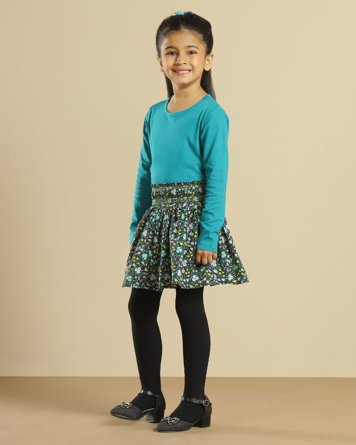 Black girls short sleeve top with green floral printed flared skirt