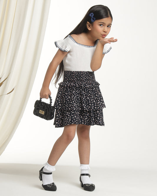 Black floral printed girls flared skirt with layered ruffle detailing and elasticated waist